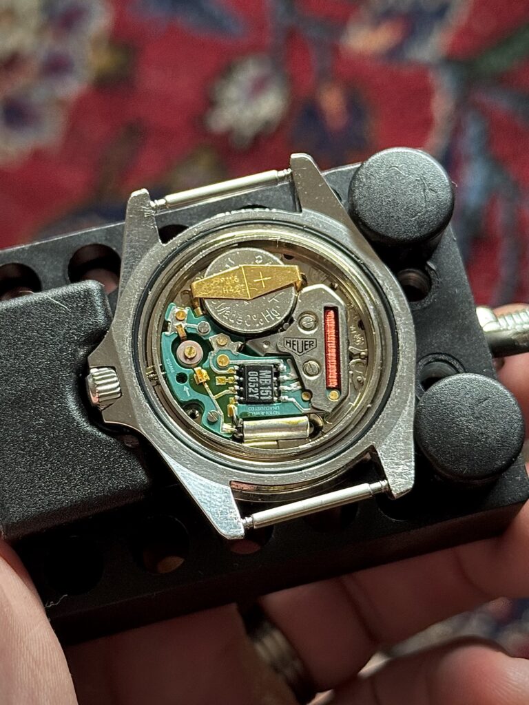 Heuer 1000 orange dial 980.014L caseback showing movement